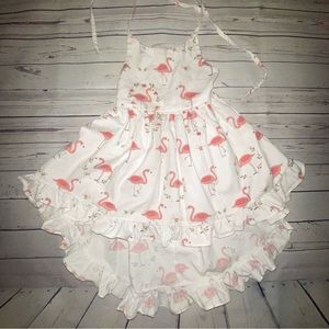 White kids dress with flamingos
